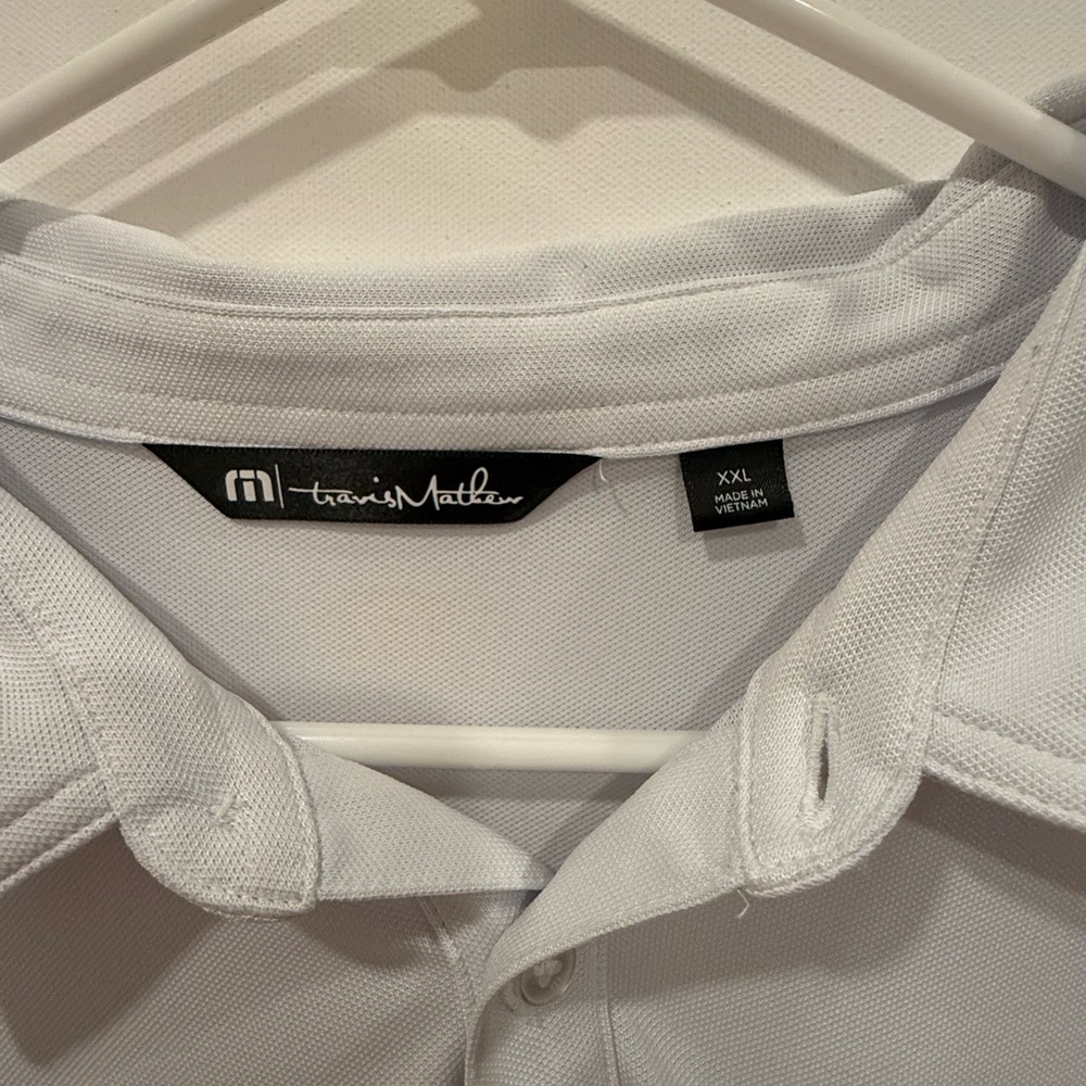 Travis Mathew polo. XXL. Good condition. Blue, white with colored stripes.